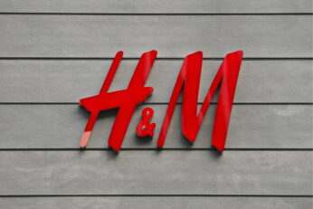 epa01487744 A corporate logo of the H&M is seen at the company's shop in Tokyo's upscale Ginza shopping district, Japan, 14 September 2008. Swedish fashion retailer giant Hennes and Mauritz (H&M) opened its first store in Japan on 13 September, making the competition in the Japanese  fashion industry even fiercer than what it already is now. More than 2,000 shoppers queued at the store on Sunday to get their hands on the Stockholm-based company's affordable yet fashionable products. H&M plans to open two more stores in Tokyo's leading fashion districts of Shibuya and Harajuku.  EPA/DAI KUROKAWA